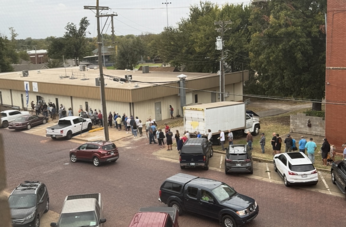 County voters wait in long lines Wednesday morning to participate in ...